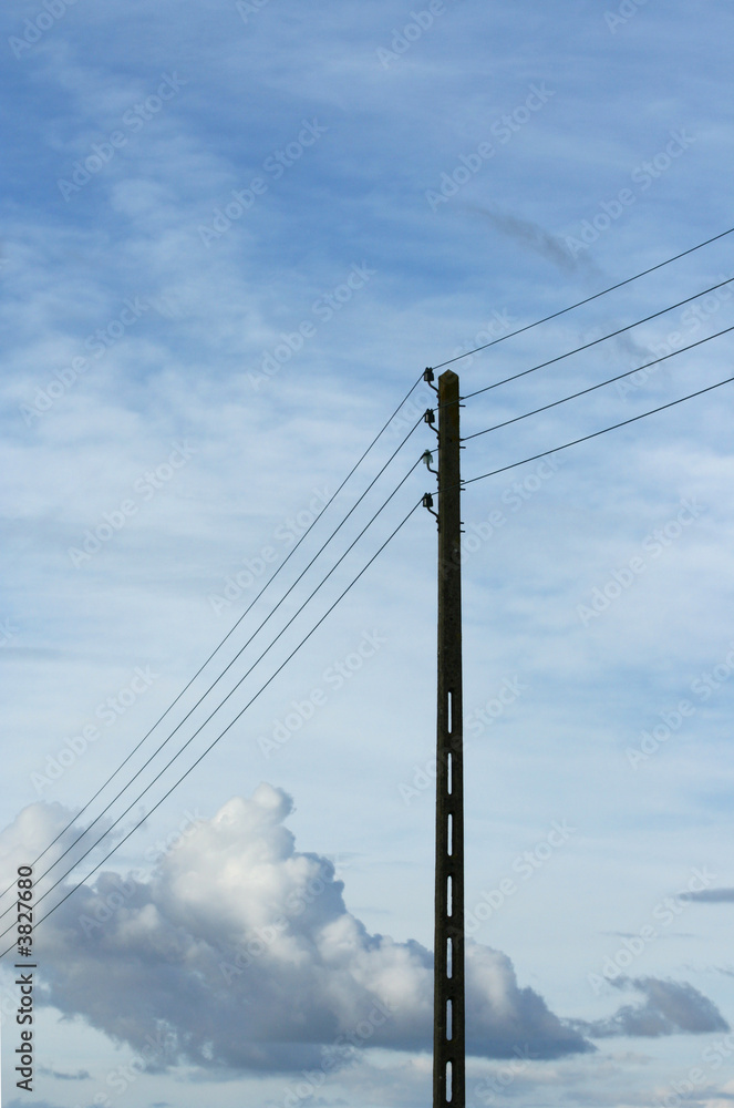 Power pole on a blue sky background