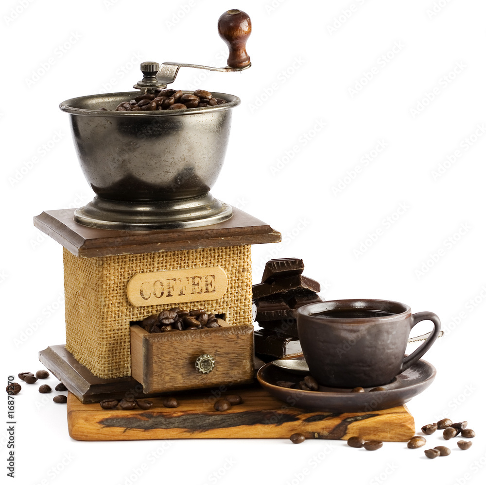 Still life with cup of coffee and coffee-mill