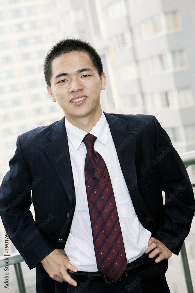 young asian businessman on the balcony