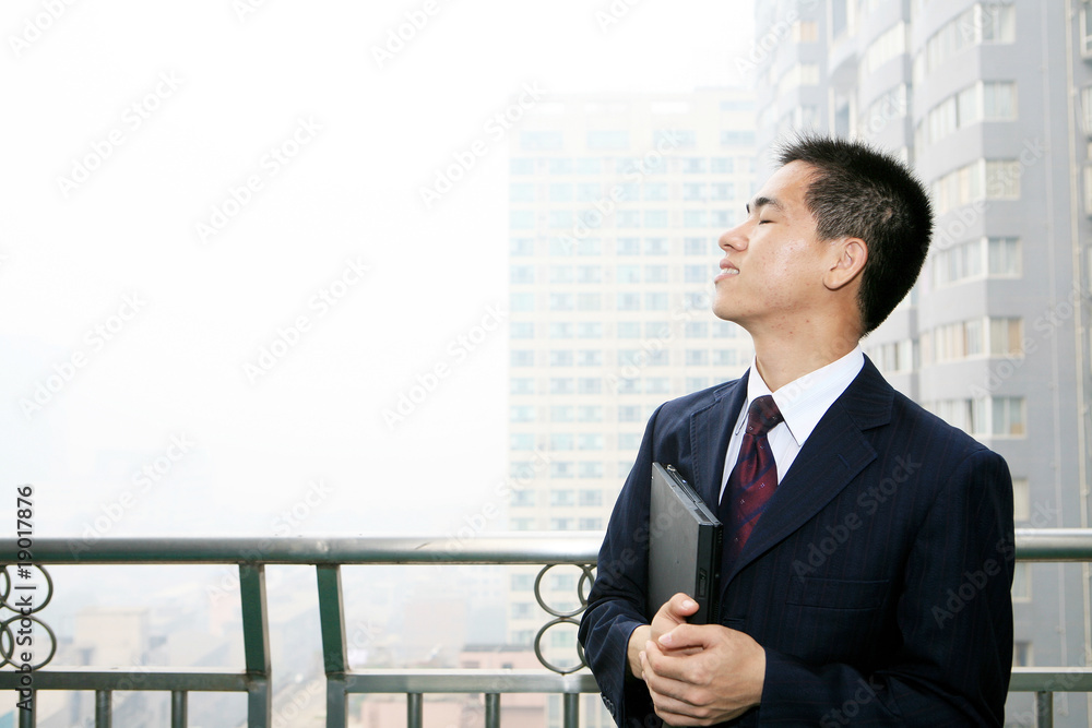 young asian businessman On the Balcony