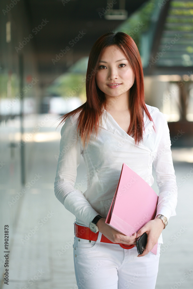 Beautiful Customer Representative holding with folder