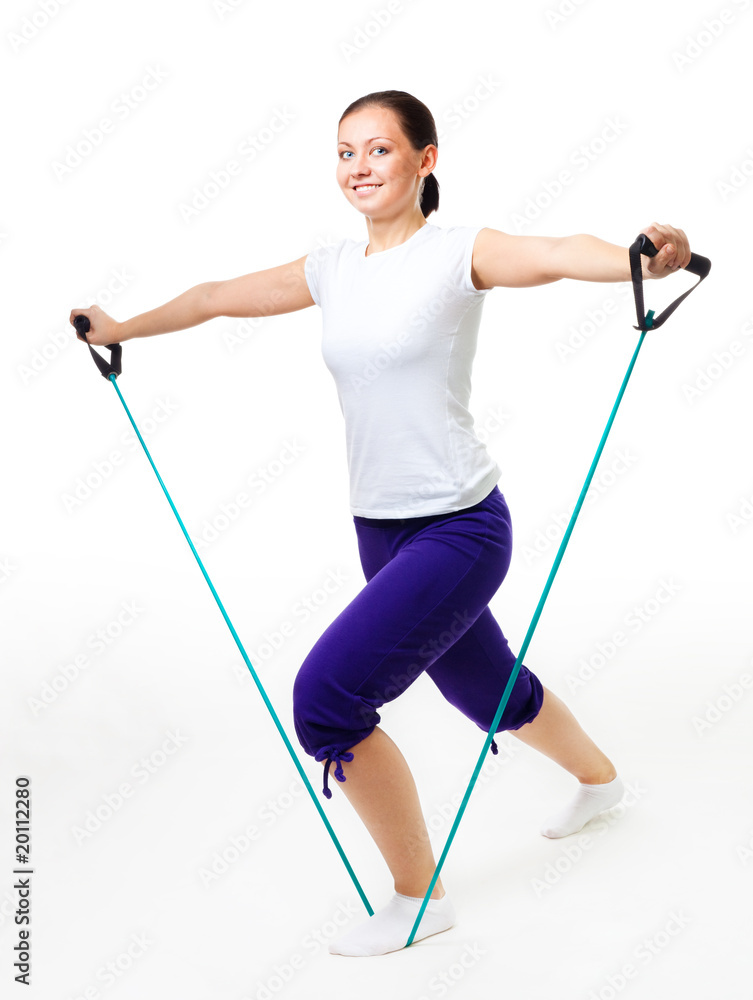 年轻女性用扩张器健身