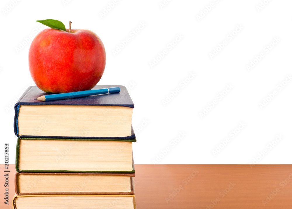Books and apple isolated on white background