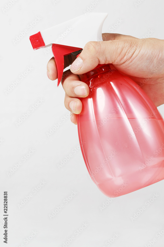 Holding a pink spray cans