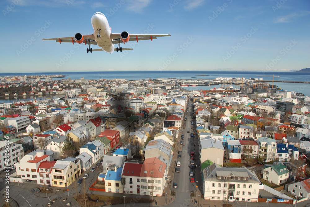 Airplane above Reykjavik city