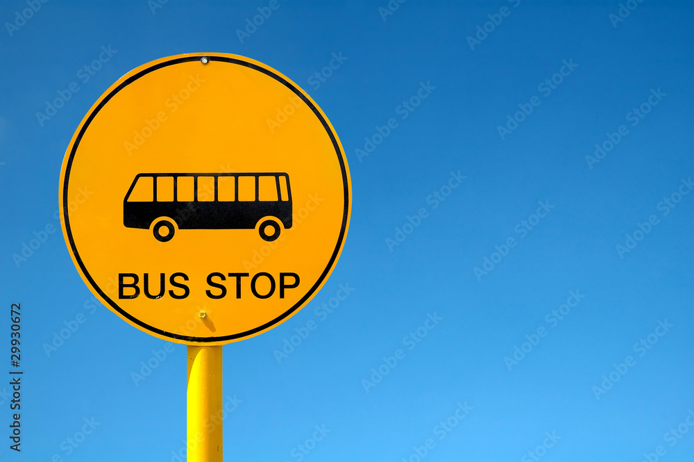 bus stop sign and blue sky