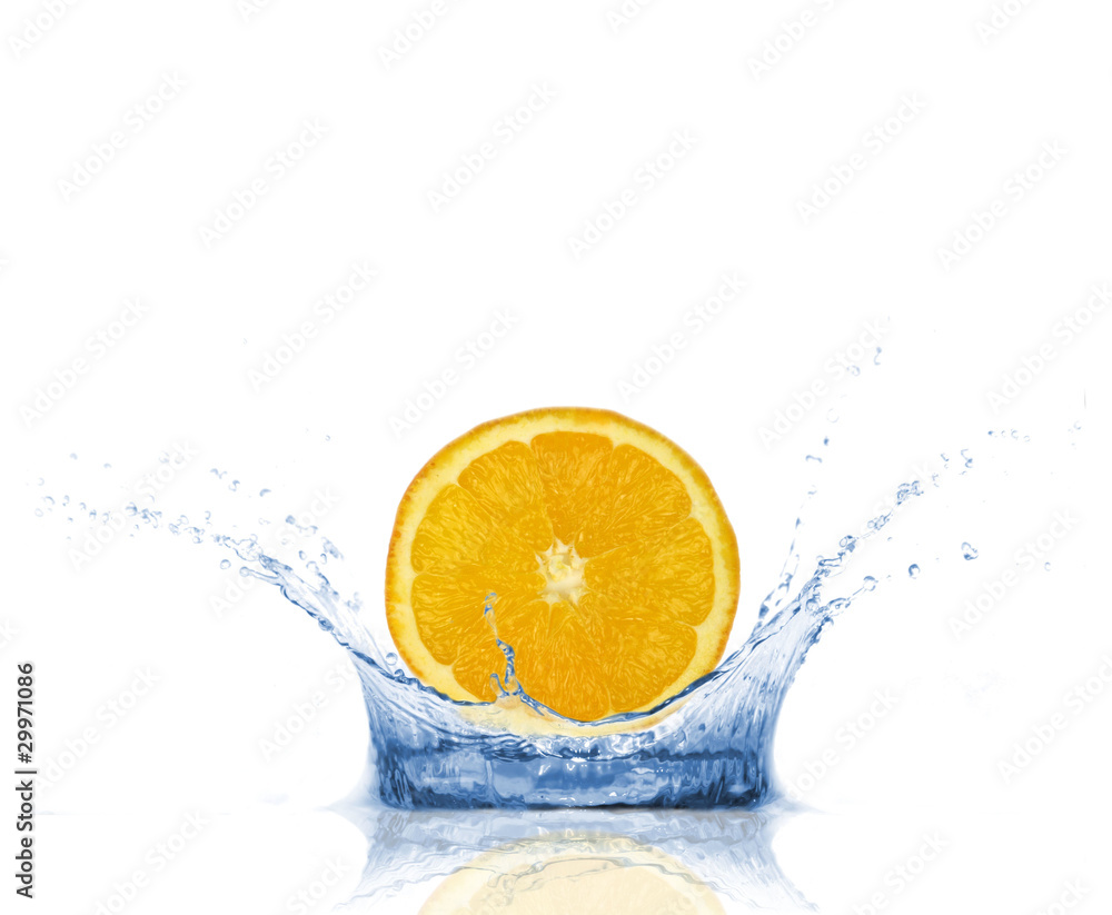 SLice of orange falling into water