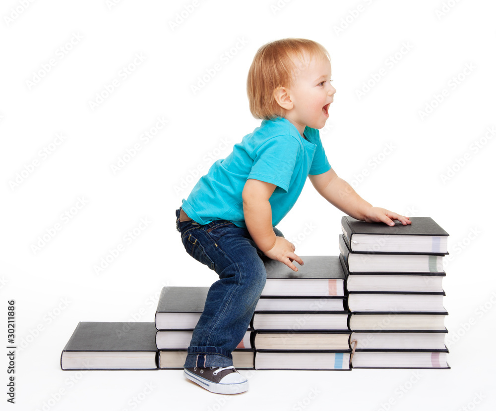 A kid on a steps of books