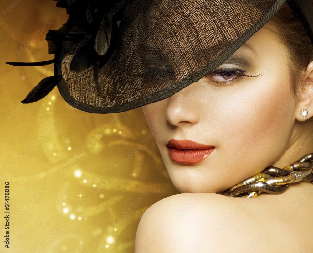 Beautiful Woman over luxury gold background