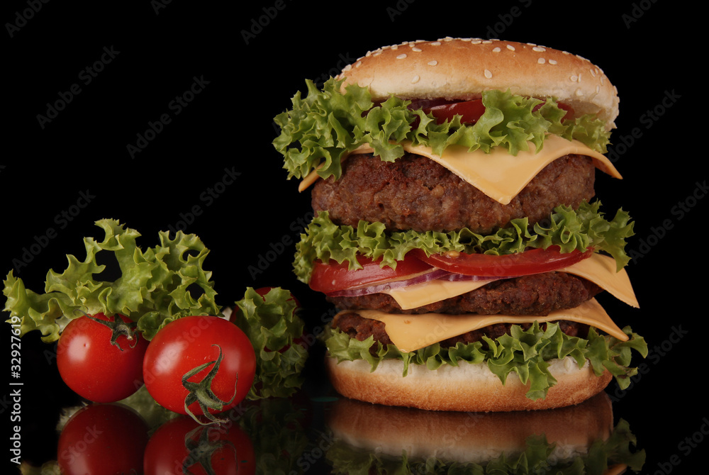 delicious hamburger on black background