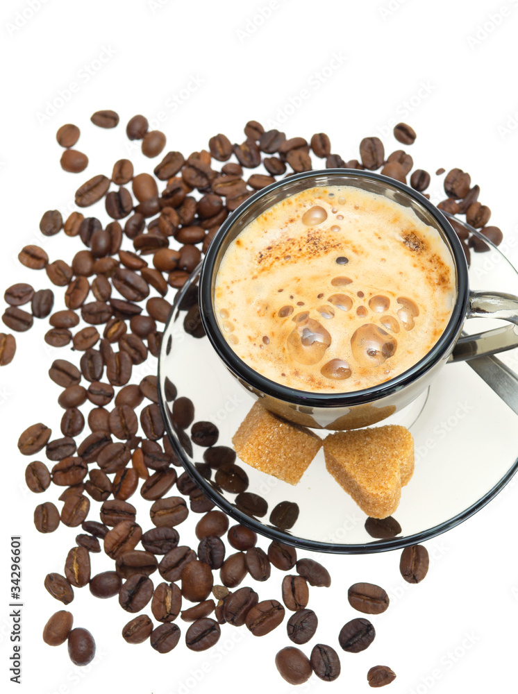 Cappuccino, brown sugar and coffee beans on white background