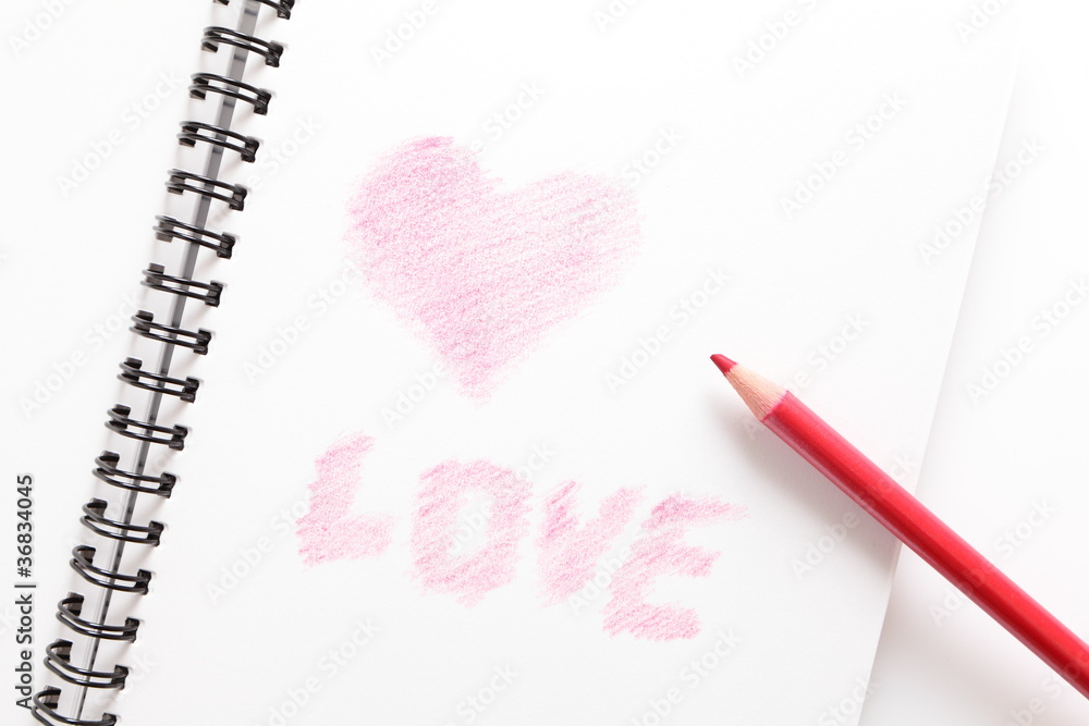 笔记本（写爱情）和白底红铅笔