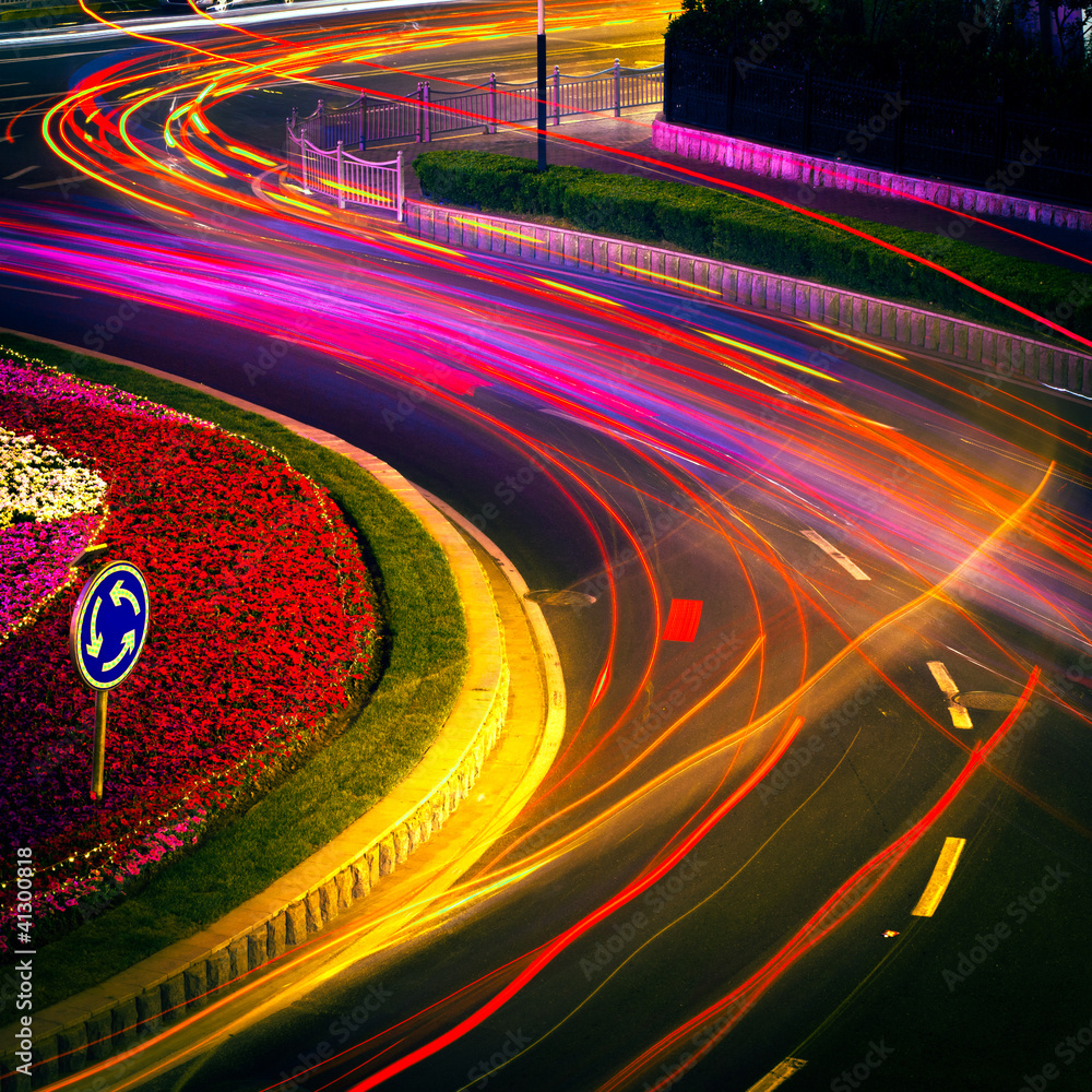 moving car with blur light through city at night