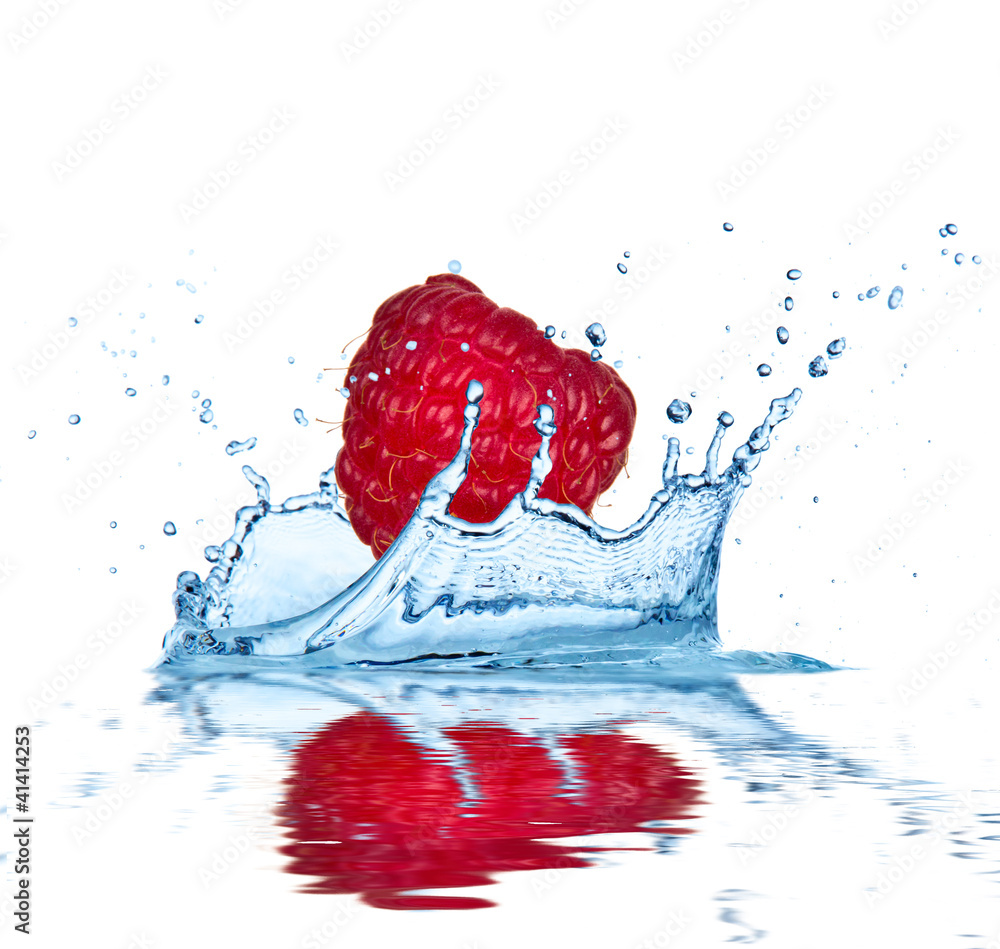 Raspberry falling into water, isolated on white background.