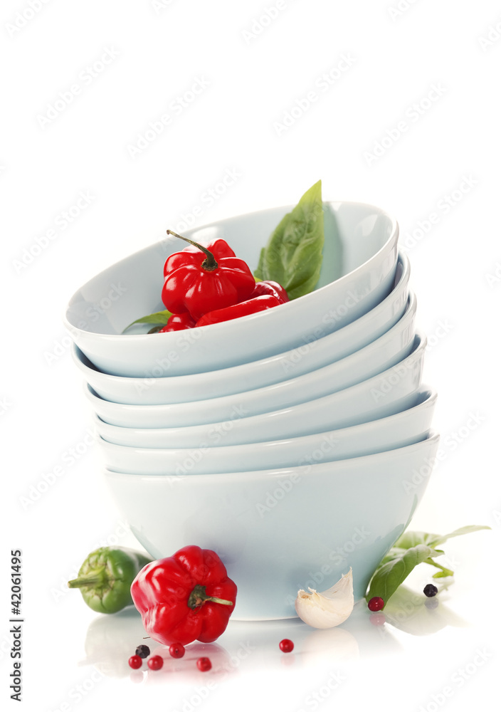 Stack of bowls and red peppers