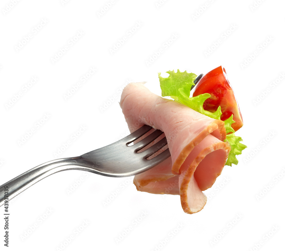 fork with meat and tomato