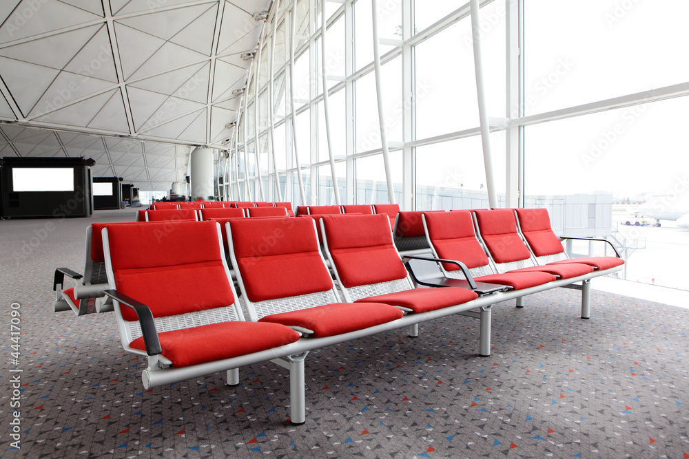 row of red chair at airport