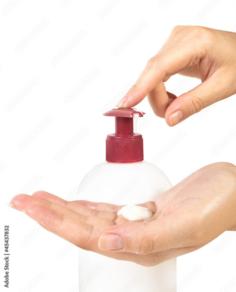 woman pressing the liquid soap to her hand
