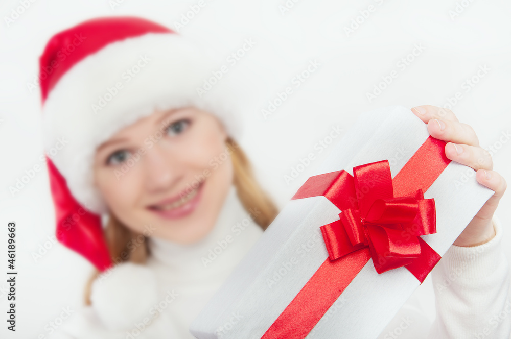 woman and Christmas present, white gift with a red ribbon