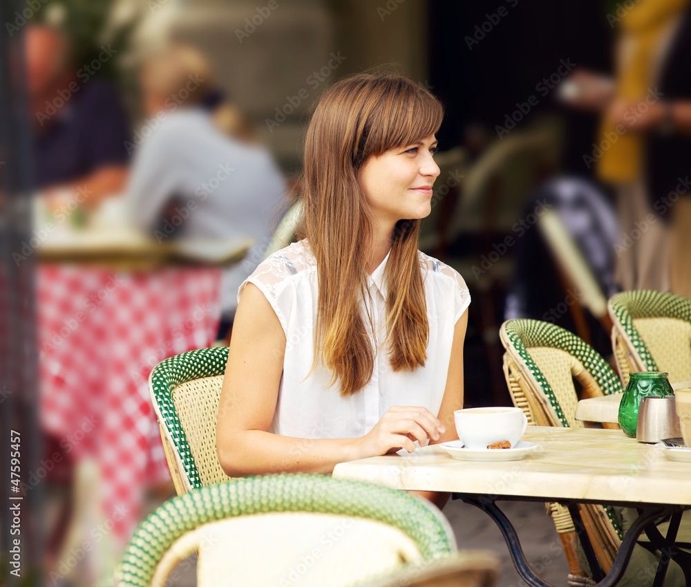 Beautiful Woman in an Outdoor Cafe