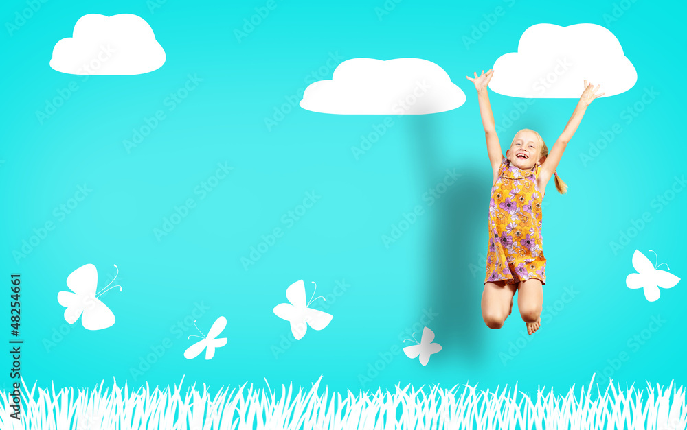girl jumping on the background of painted wall