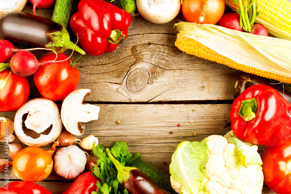 Healthy Organic Vegetables on the Wooden Background