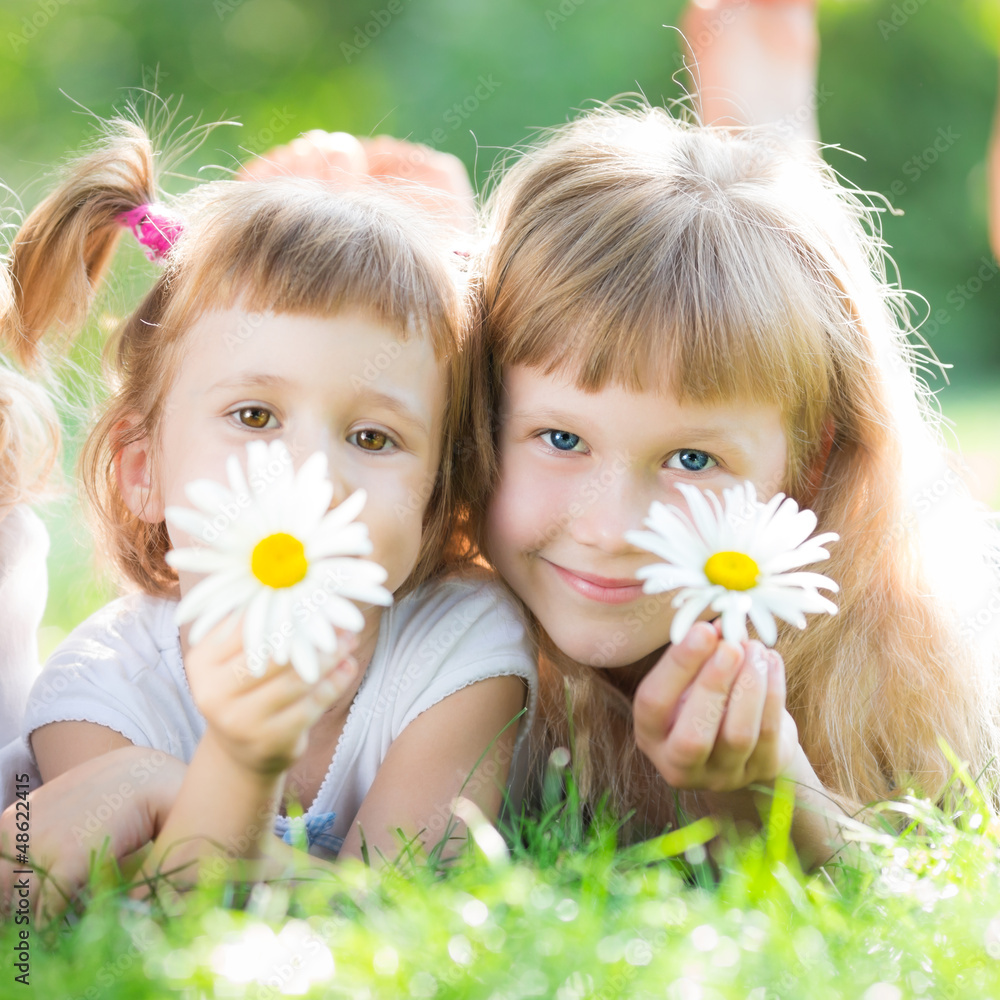 Happy children with flowers