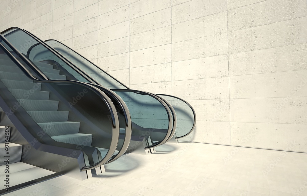 Moving escalator and empty wall in modern building