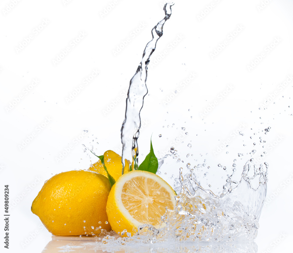 Fresh lemons with water splash, isolated on white background