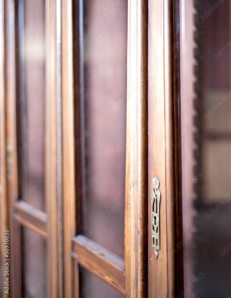 Lock on wooden cabinet, detail of classic furniture