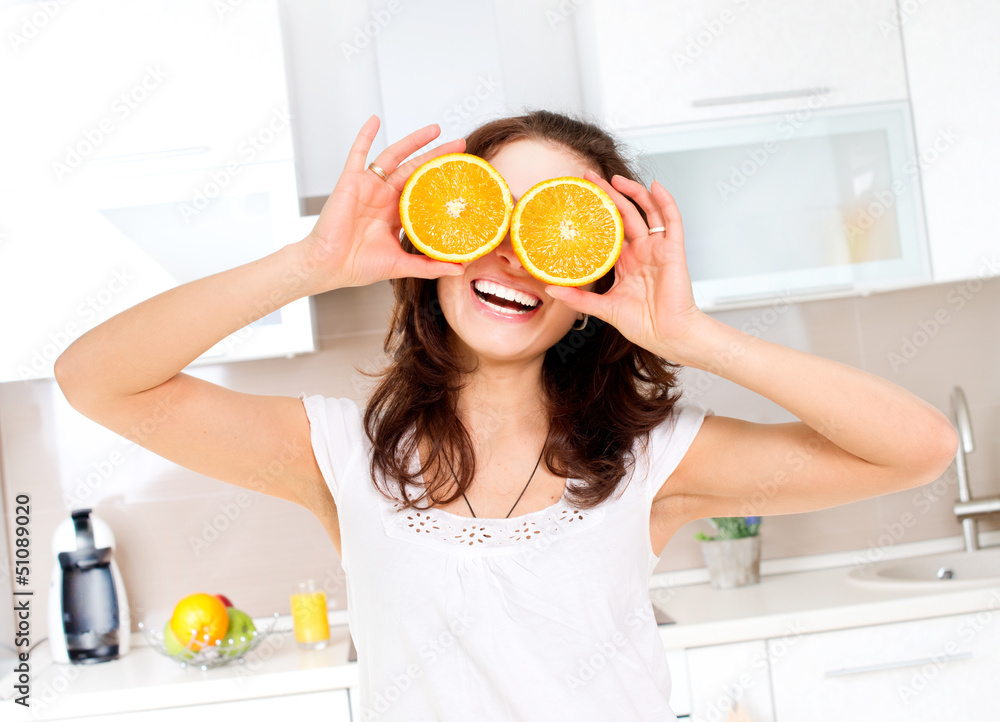 Portrait of Young and Healthy Funny Woman with Orange over Eyes