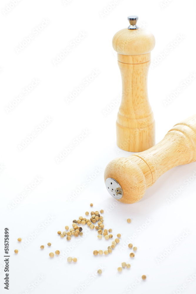 Wood pepper mill and salt shaker isolated on white