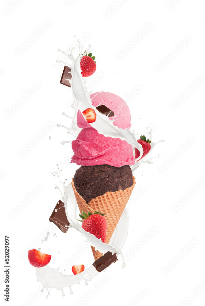 Ice cream with milk splash and pieces of fruit and chocolate