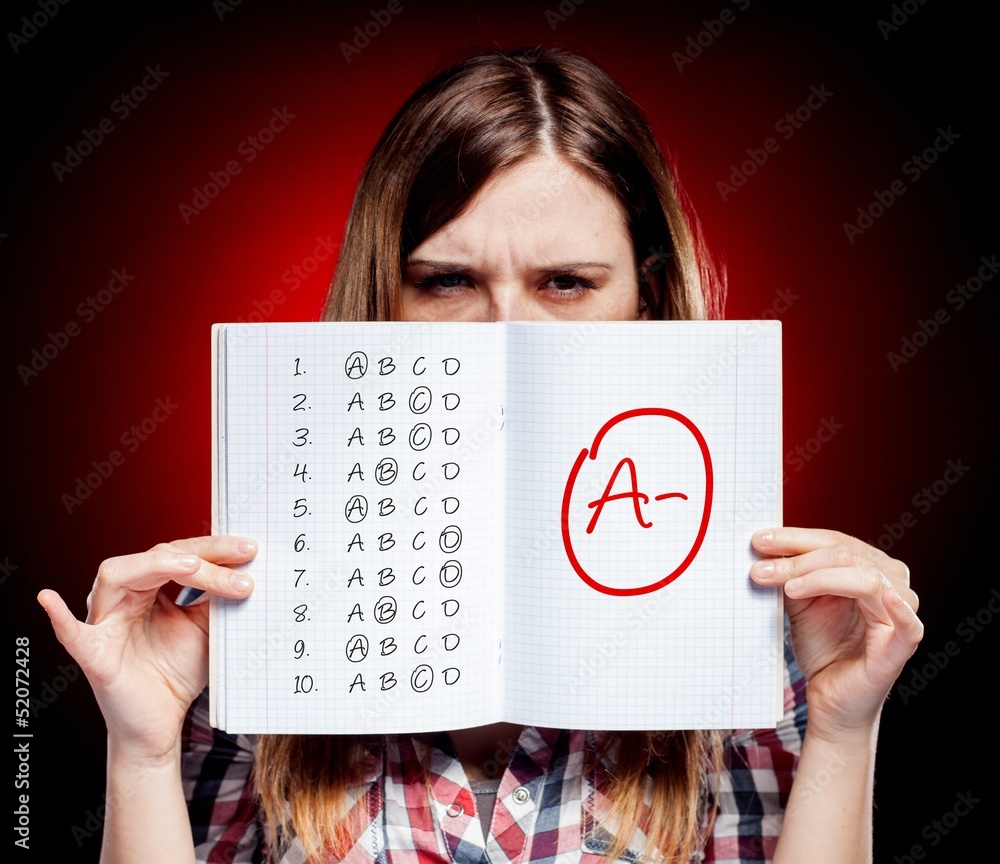 School grade of exam and disappointed girl