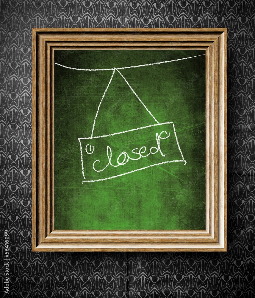 Closed sign chalkboard in old wooden frame