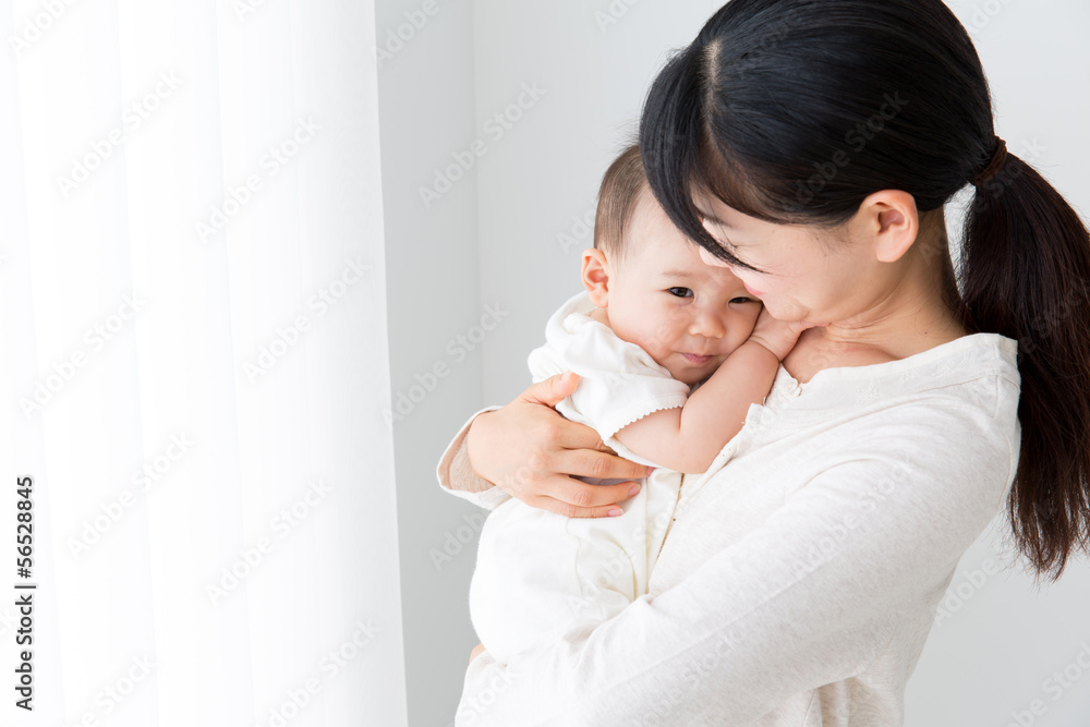 asian baby and mother relaxing