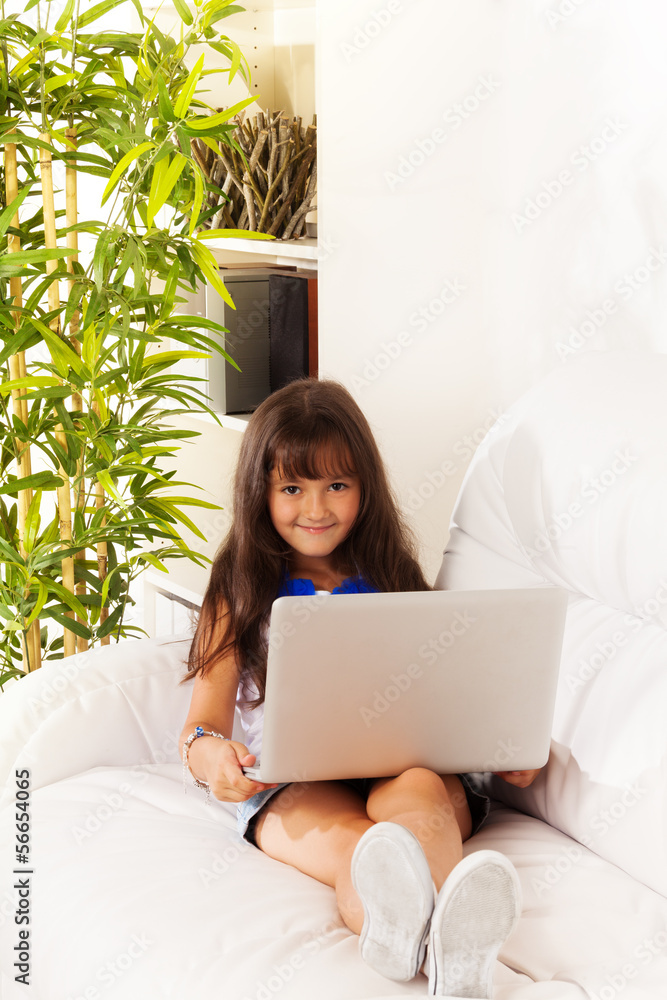 Long haired girl with laptop