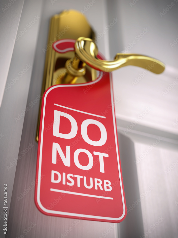 Do not disturb sign on hotel door handle