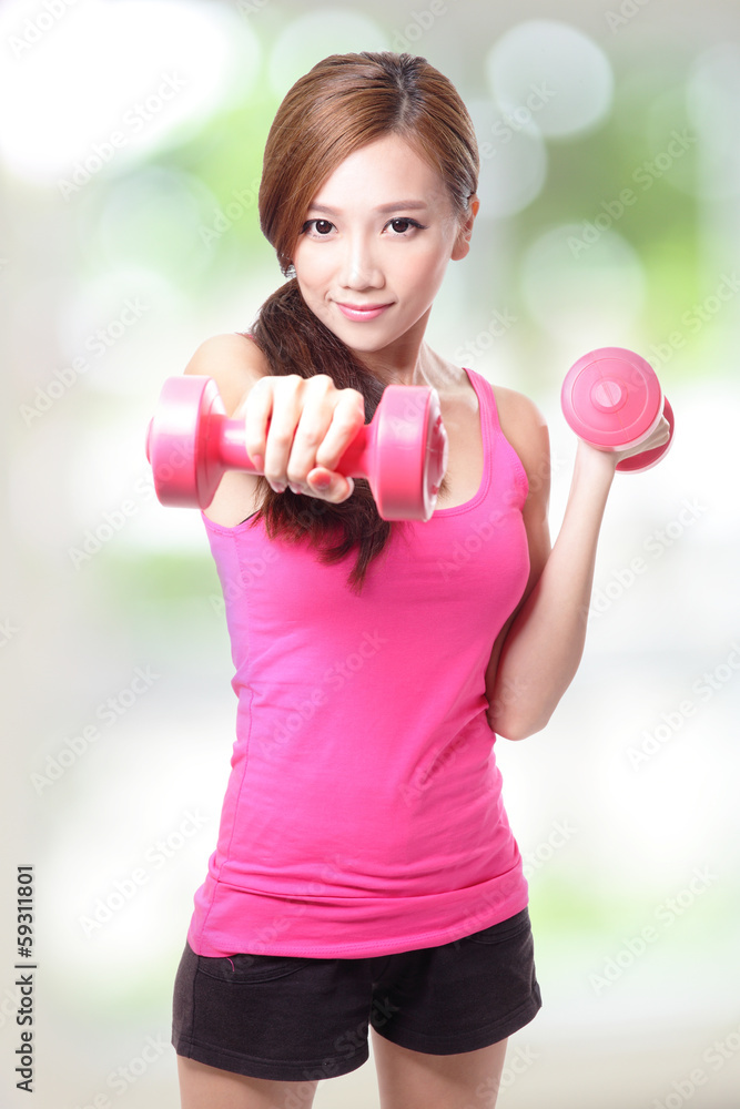 Young sport girl with dumbbells