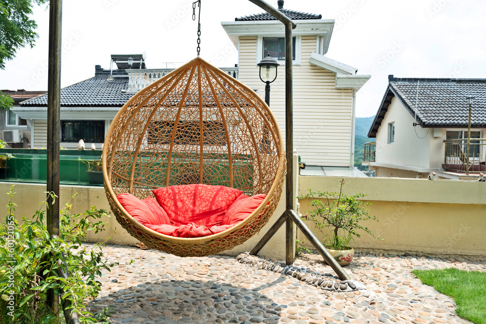 rattan hanging chair in garden