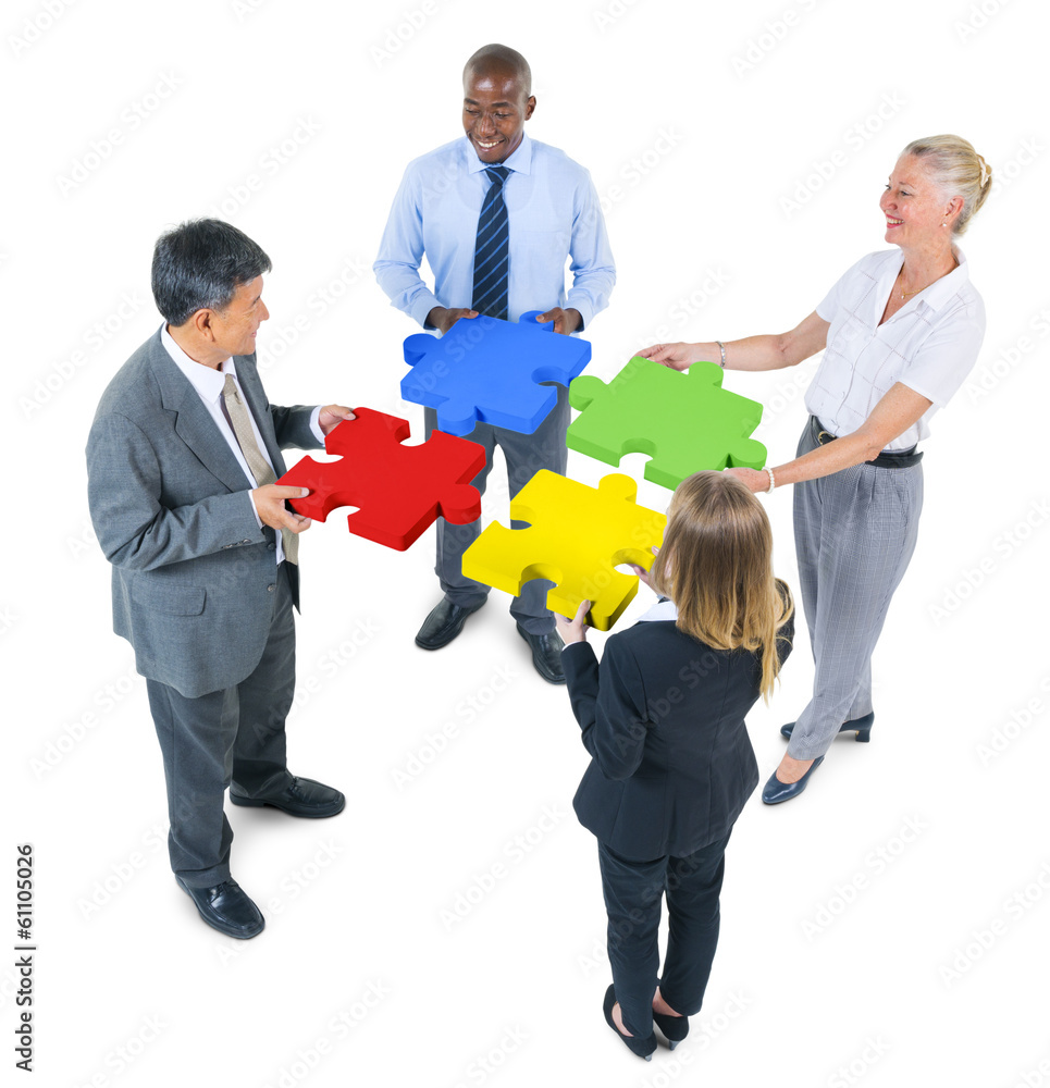 Group of Business People Building Jigsaw