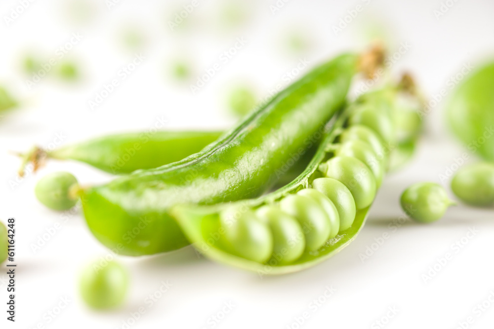 fresh green peas on white