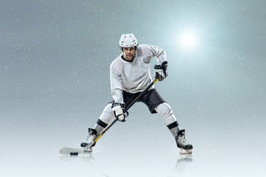 Ice hockey player on the ice and light effects