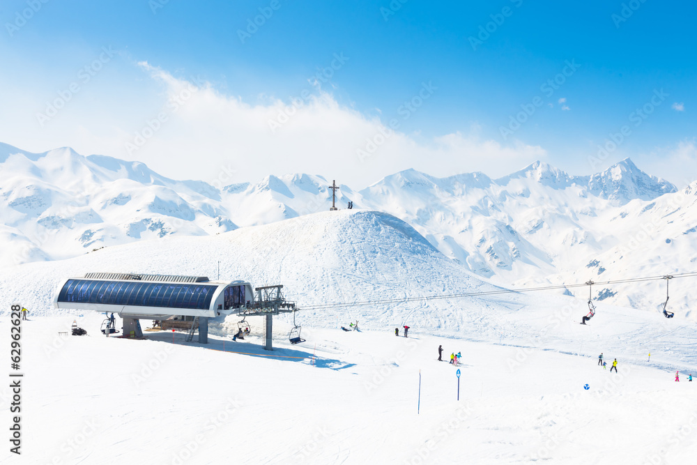 Skiers on ski lift on Vogel, Slovenia.