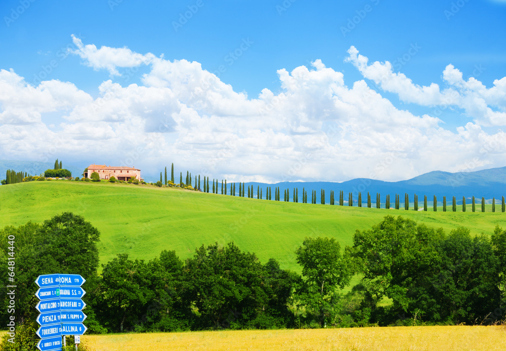 Tuscany landscape with blue sign, house in Italy