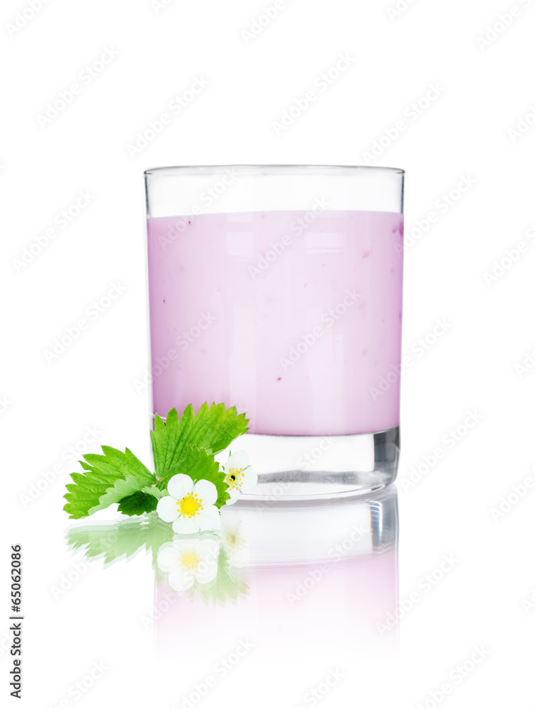 in a glass of milk and flowers on an isolated white background
