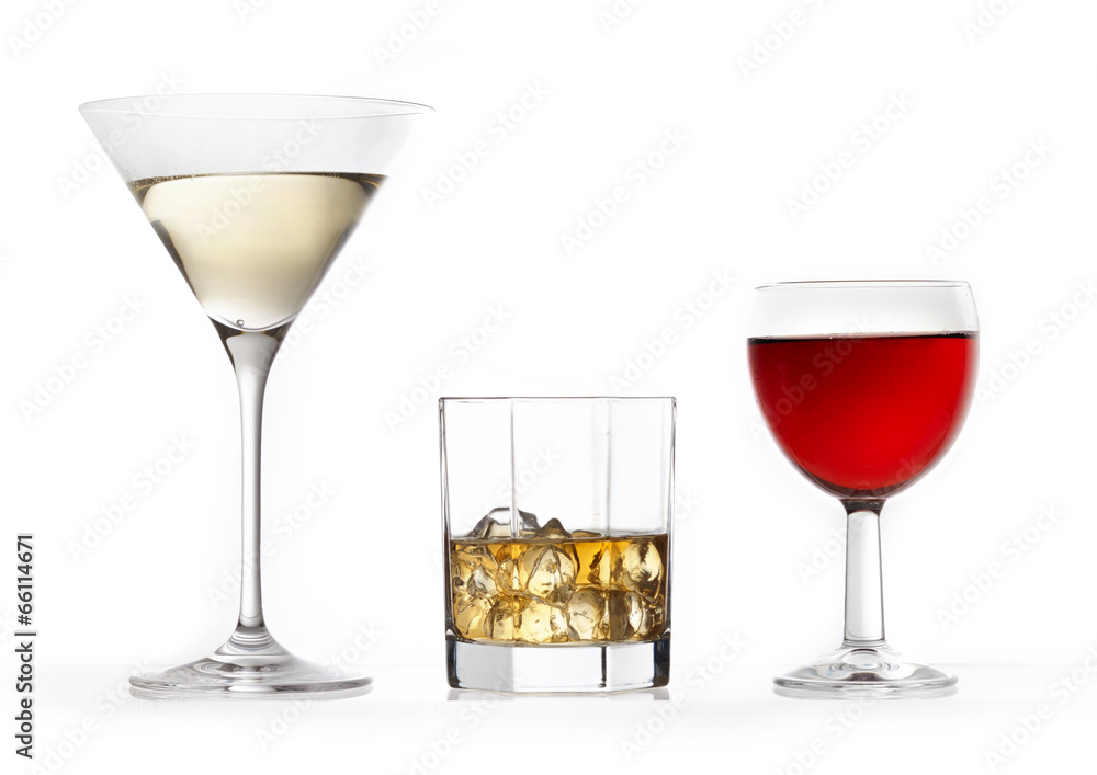 three glasses of various drinks