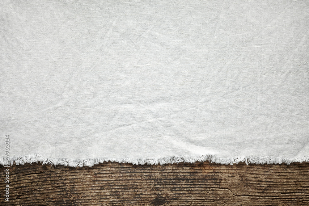 old white cotton tablecloth on wooden table