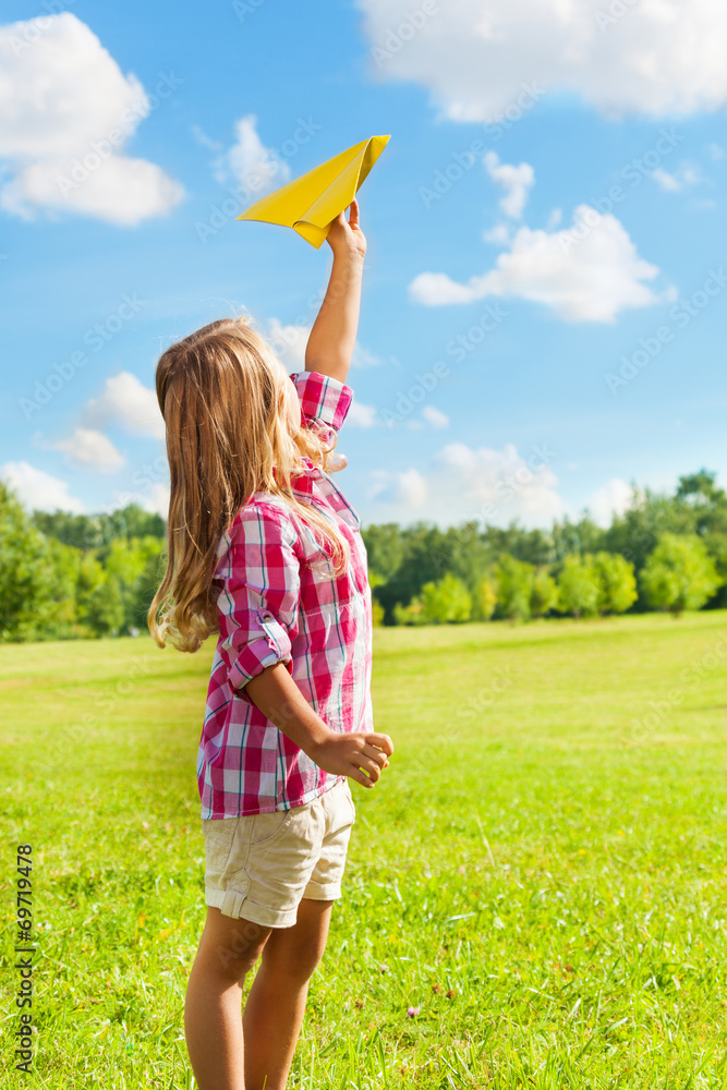 Happy child throw paper plane