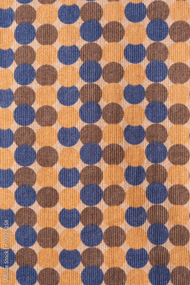 织物上蓝色和橙色圆点图案的纹理
